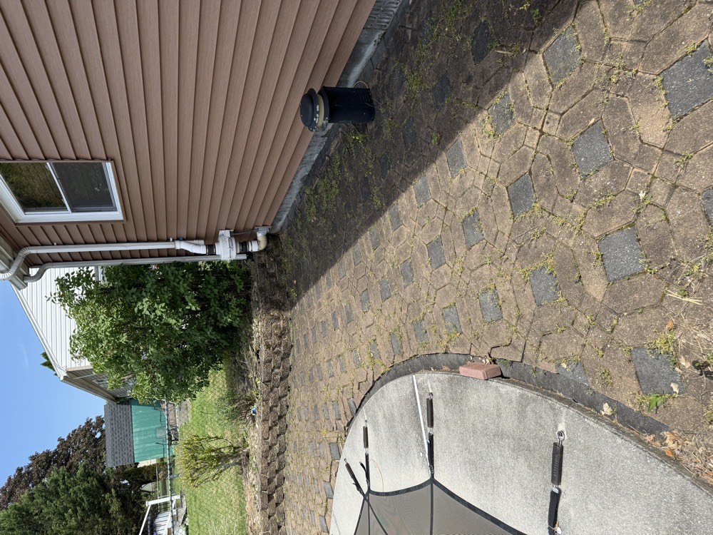 Worn paver patio before renovation